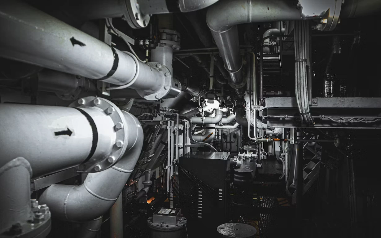 Clean and orderly ship engine room representing digital infrastructure engineering